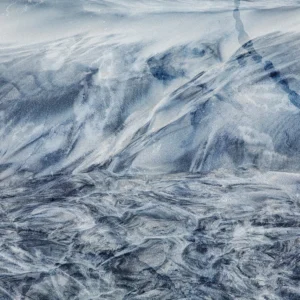A textured visual evoking the fluid motion of cool water.