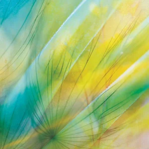 Gently blurred macro dandelions with green and gold accents.