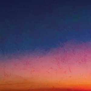 Atmospheric gradient blending deep blue into warm pink, orange, and gold.