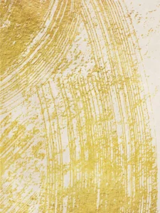 Bold gold brushstrokes sweep across a neutral backdrop, creating a textured, modern composition.