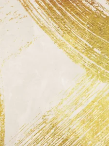 Bold gold brushstrokes sweep across a neutral backdrop, creating a textured, modern composition.