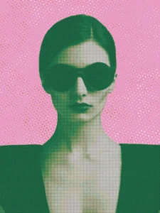 Bold portrait of a woman in sunglasses set against a vivid pink background.
