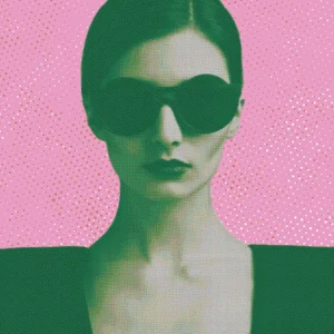 Bold portrait of a woman in sunglasses set against a vivid pink background.