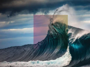 Powerful ocean wave merges with geometric overlay, blending nature and abstract color fields.