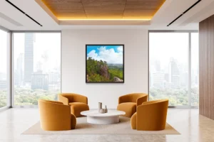 Towering cliffs with pine trees overlook a vast, lush forest under blue skies.