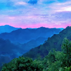 Sunset over layered forested hills with glowing sky and silhouetted trees.