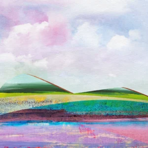 Cotton candy clouds watch over rolling stunning hills and an enchanting lake.