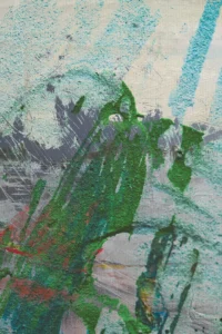 A wolfish figure rises from streaks of green mire under a blazing blue sky.