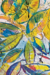 Striking mural of bright wide leaves cover the space in a blast of longing for adventure in nature.