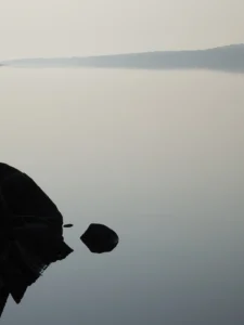 Muted tones and still reflections create a tranquil moment of perfect calm.