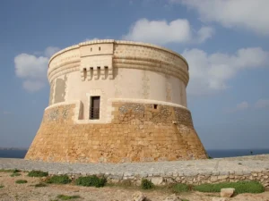 Prominent historic defensive tower built to protect the harbor of Fornells, located on the island of Menorca, Spain.