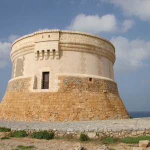 Prominent historic defensive tower built to protect the harbor of Fornells, located on the island of Menorca, Spain.
