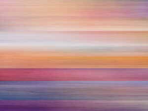 Warm rose and amber hues melt into twilight’s serene, horizon-spanning embrace.